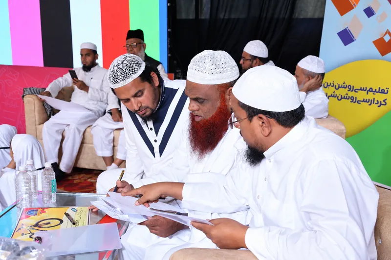 South Asian Men Reviewing Documents at Conference