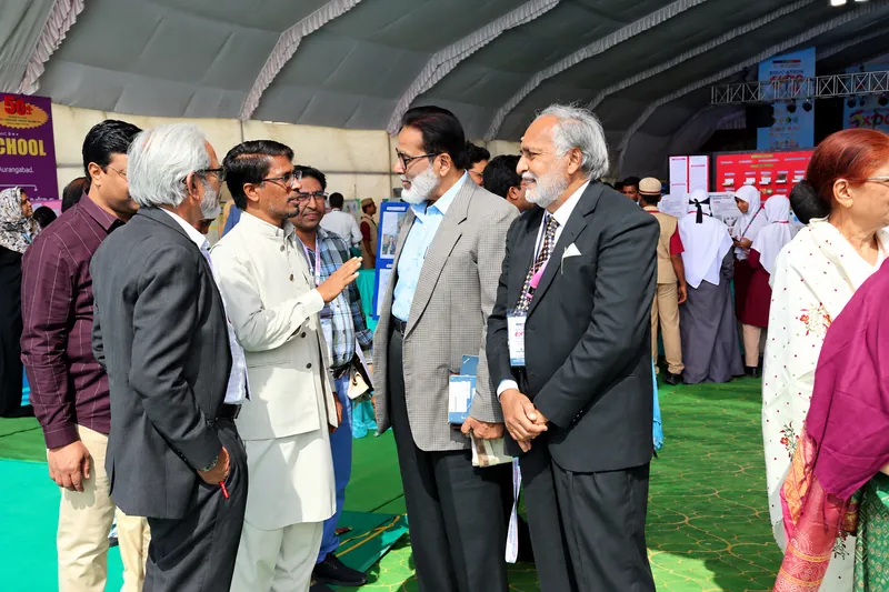 Education Expo Conversation under a Tent